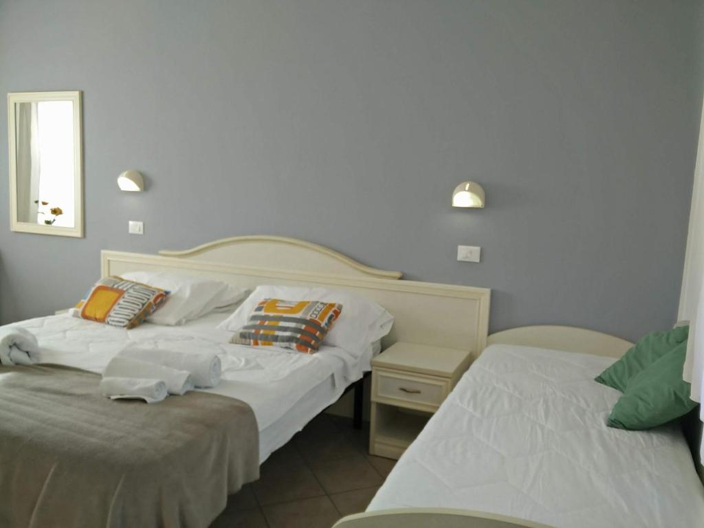 Postel nebo postele na pokoji v ubytování Hotel Garnì Anna