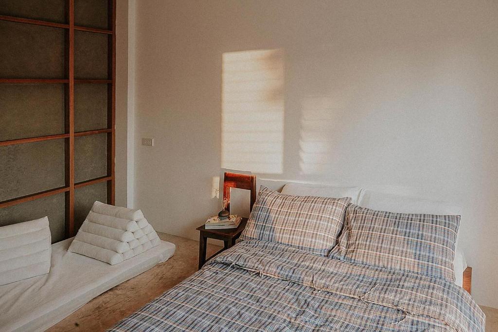 Postel nebo postele na pokoji v ubytování Baan Lek Villa