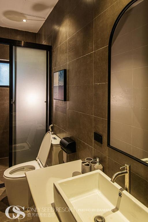 Koupelna v ubytování Only Seed Resort 欧芮希度假酒店