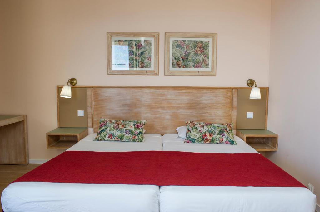Postel nebo postele na pokoji v ubytování Buganvilia Studio Hotel