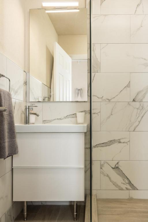 a bathroom with a sink and a mirror at West Rock Villas in Saint James
