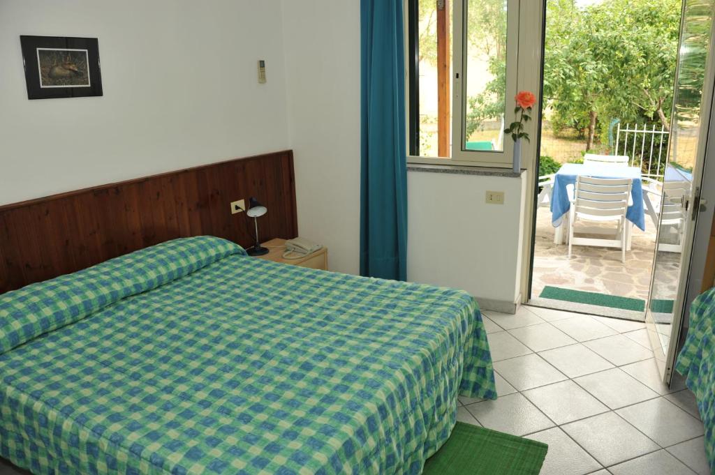 Postel nebo postele na pokoji v ubytování Hotel Edera