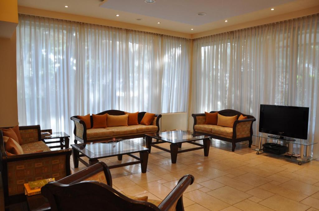TV a/nebo společenská místnost v ubytování Hotel Chris