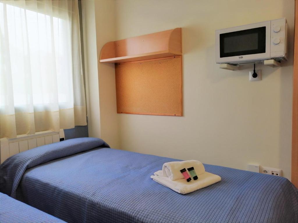 Postel nebo postele na pokoji v ubytování Residencia Universitaria Resa As Burgas