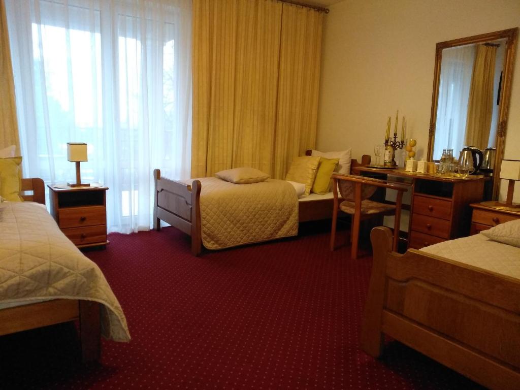 Postel nebo postele na pokoji v ubytování Hotel Polak