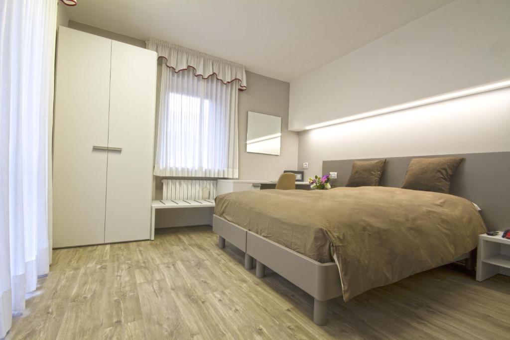 Postel nebo postele na pokoji v ubytování Hotel Venezia