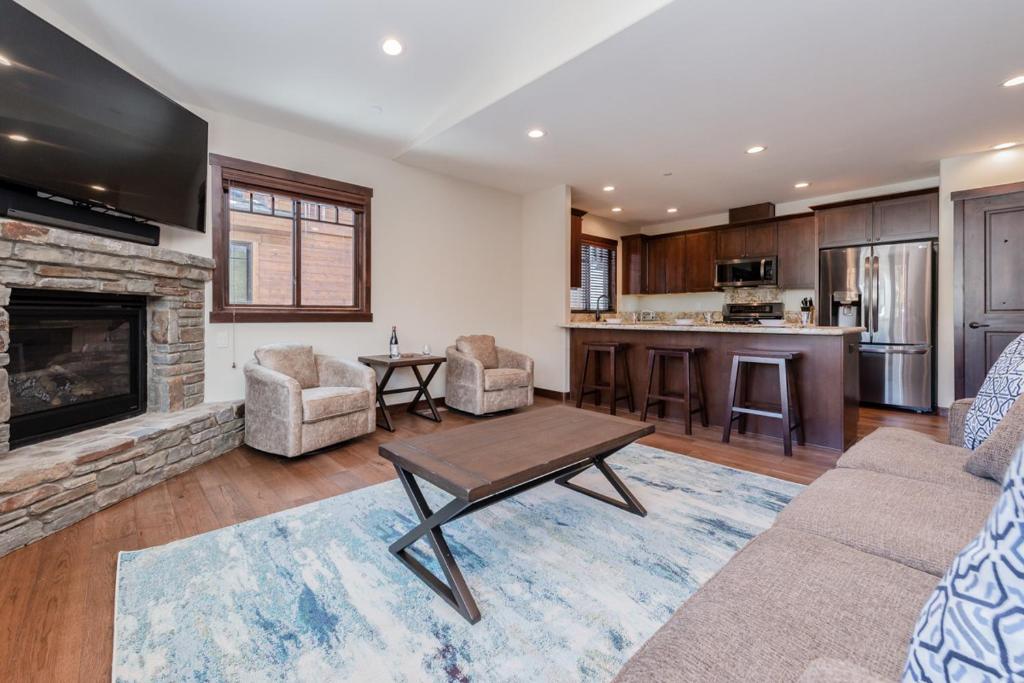 a living room with a couch and a fireplace at Mountainside 5 in Mammoth Lakes
