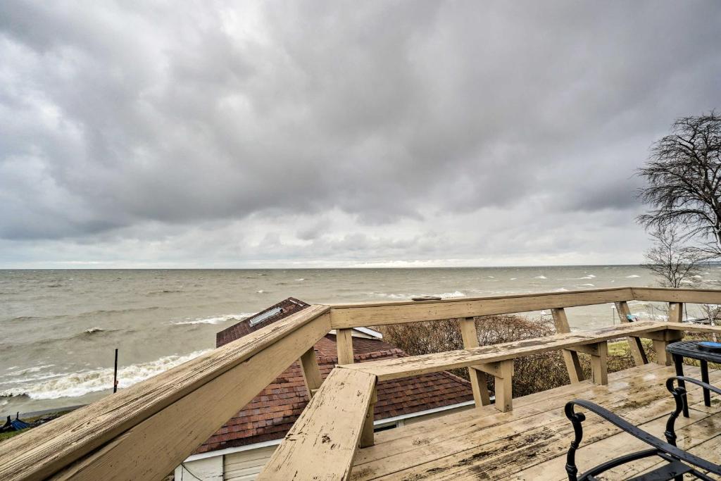 a view of the ocean from a wooden deck at Lakefront Geneva Vacation Rental - Walk to Strip! in Geneva-on-the-Lake