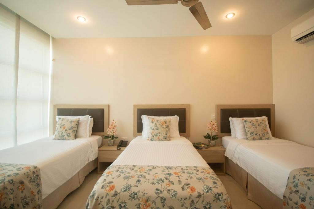 Postel nebo postele na pokoji v ubytování Hotel Santorini Loft