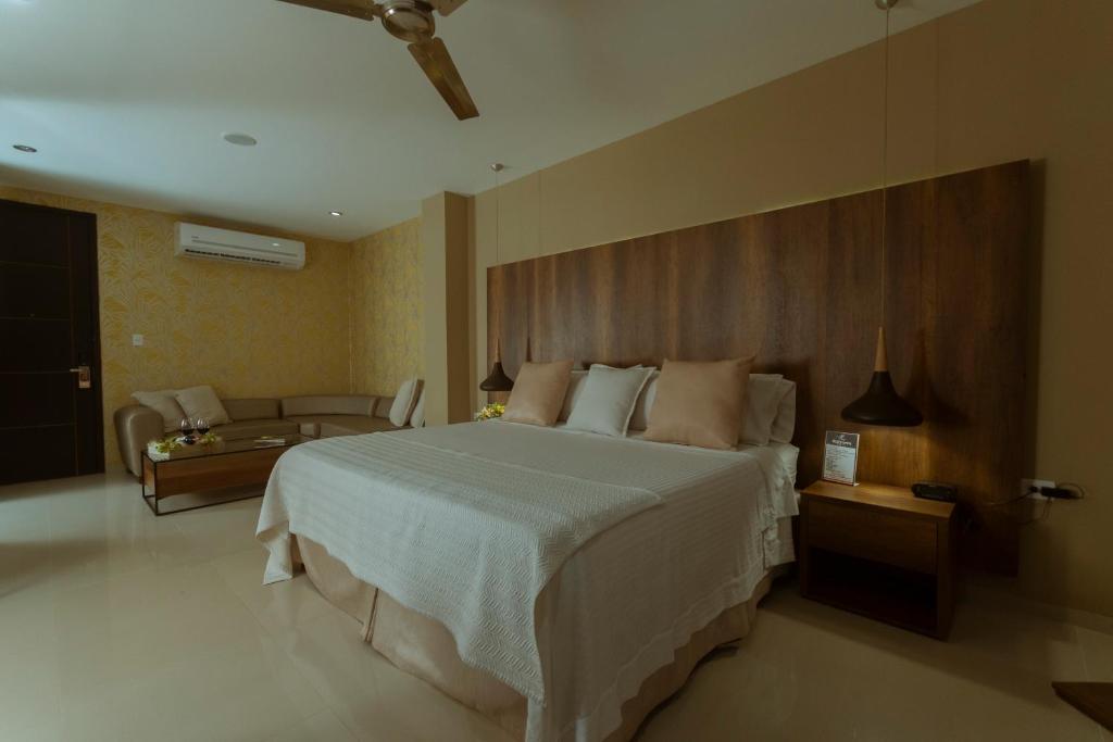 Postel nebo postele na pokoji v ubytování Hotel Santorini Loft