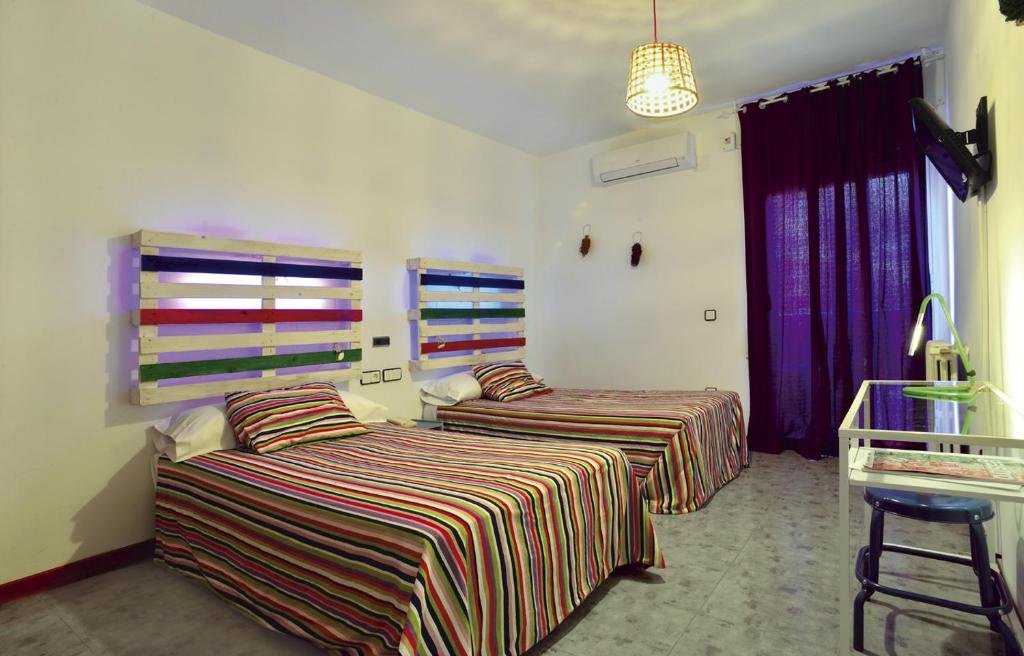 Postel nebo postele na pokoji v ubytování Hotel Rio Piedra