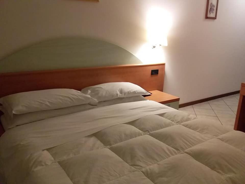 Postel nebo postele na pokoji v ubytování Hotel Il Cammino Di Francesco
