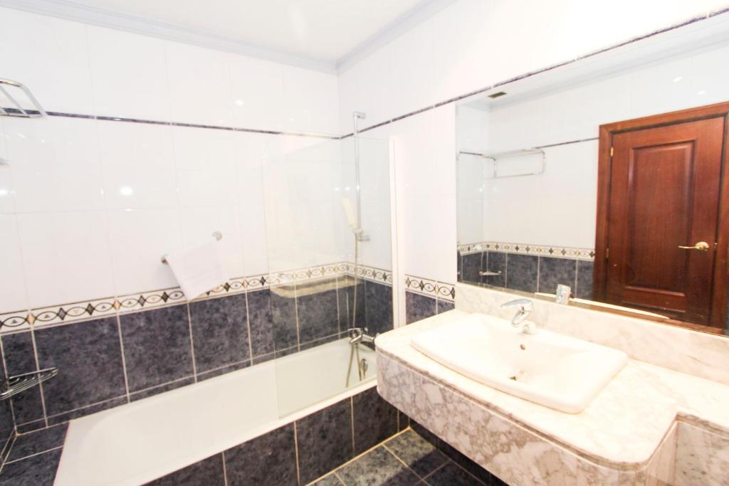 Koupelna v ubytování Hotel Castellano Centro