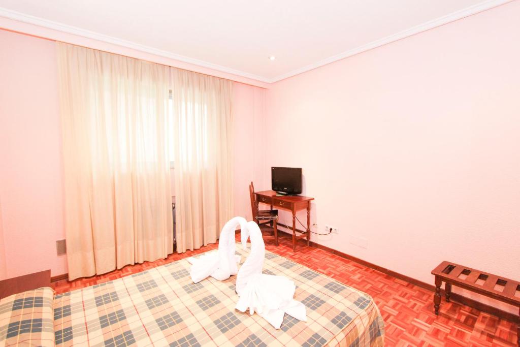 Postel nebo postele na pokoji v ubytování Hotel Castellano Centro