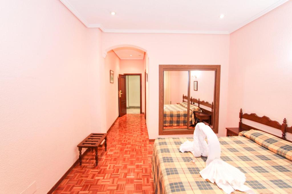 Postel nebo postele na pokoji v ubytování Hotel Castellano Centro
