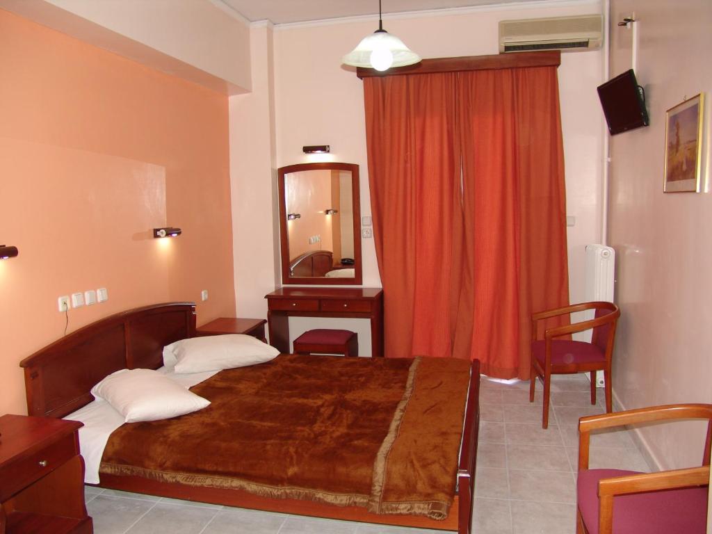 Postel nebo postele na pokoji v ubytování Hotel Cosmos