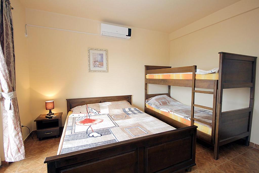 Postel nebo postele na pokoji v ubytování Villa Jupok