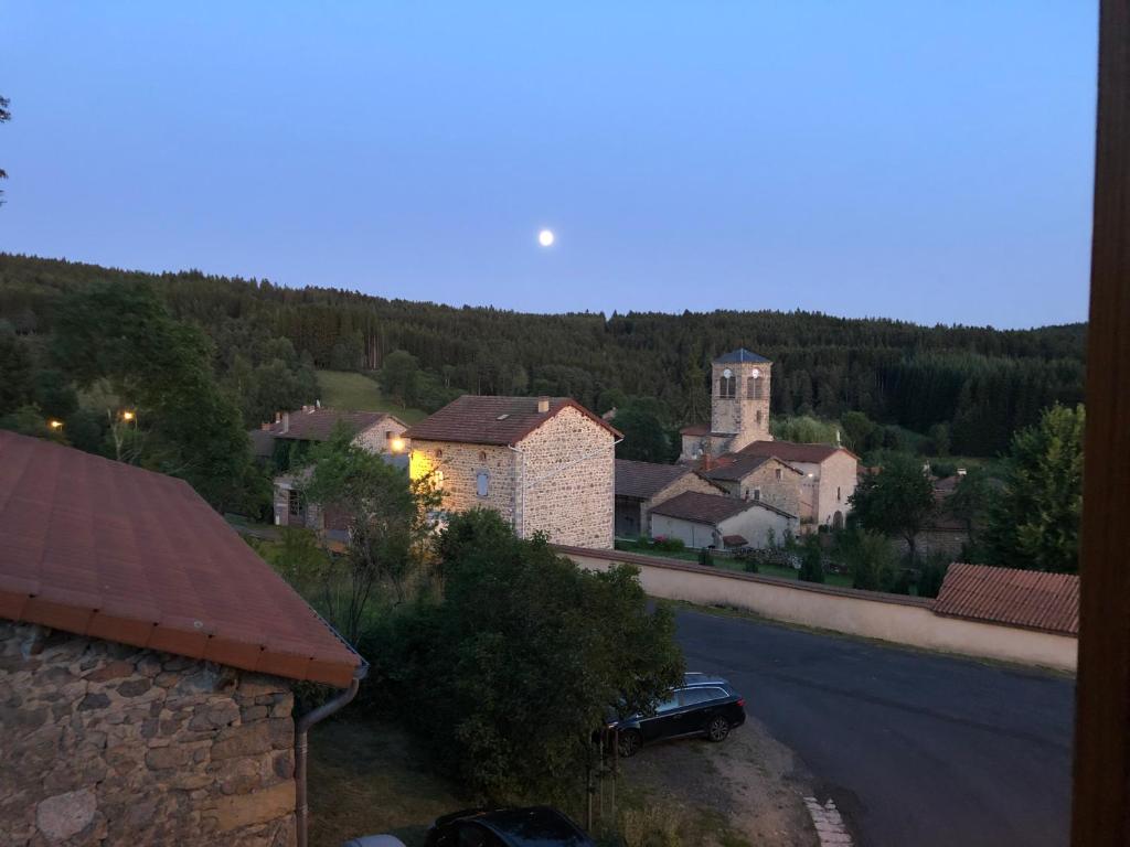 a view of a village with a car parked on the street at Large 100 year old house in lovely walking area in Fayet-Ronaye