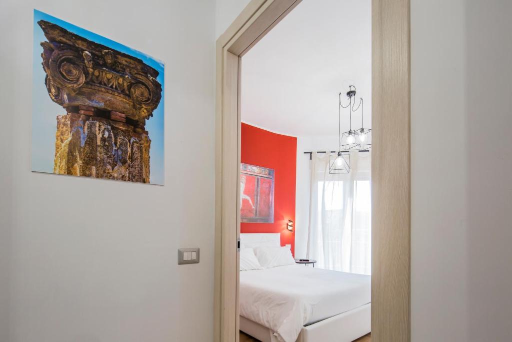 Posteľ alebo postele v izbe v ubytovaní Pompei Centrum