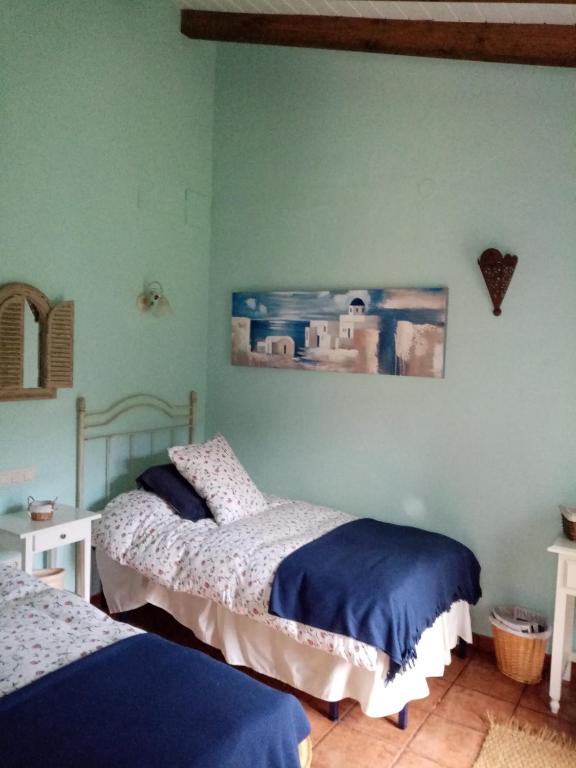A bed or beds in a room at Hotel Rural El Marquesito Antigua Casa Carmela