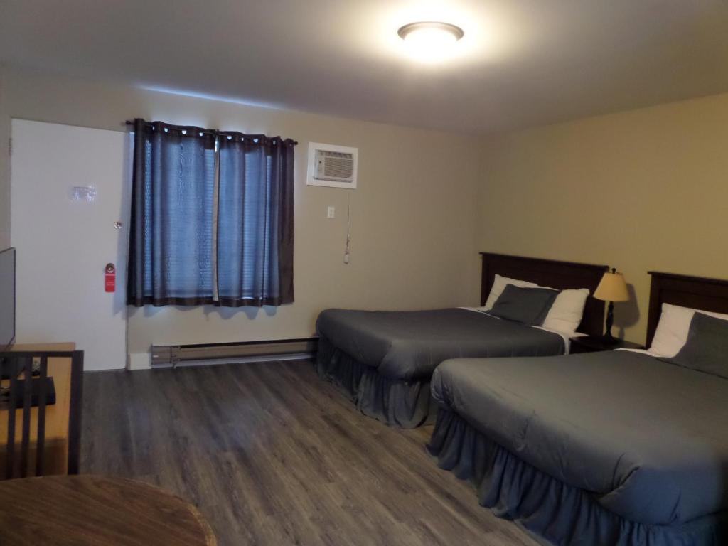 Postel nebo postele na pokoji v ubytování Ray Lyn Motel