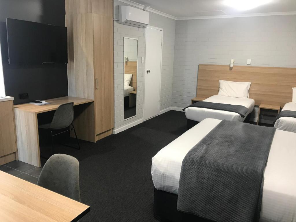 Postel nebo postele na pokoji v ubytování Frewville Motor Inn