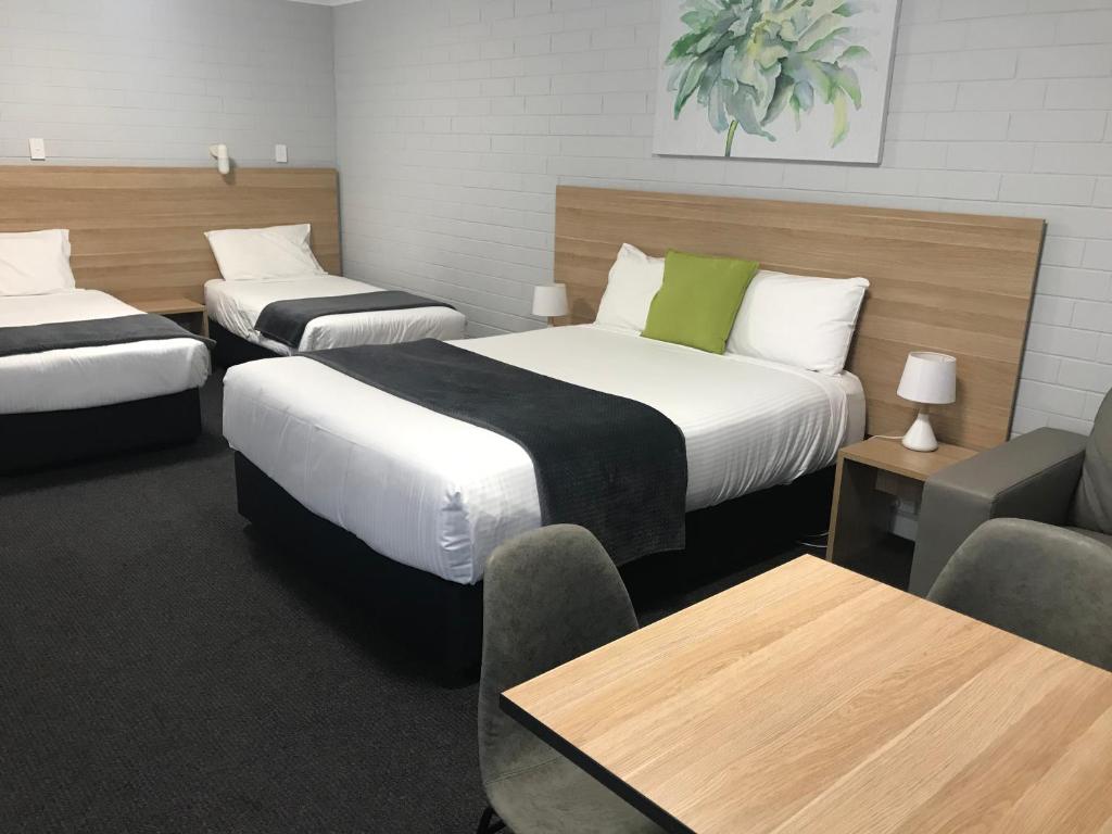Postel nebo postele na pokoji v ubytování Frewville Motor Inn