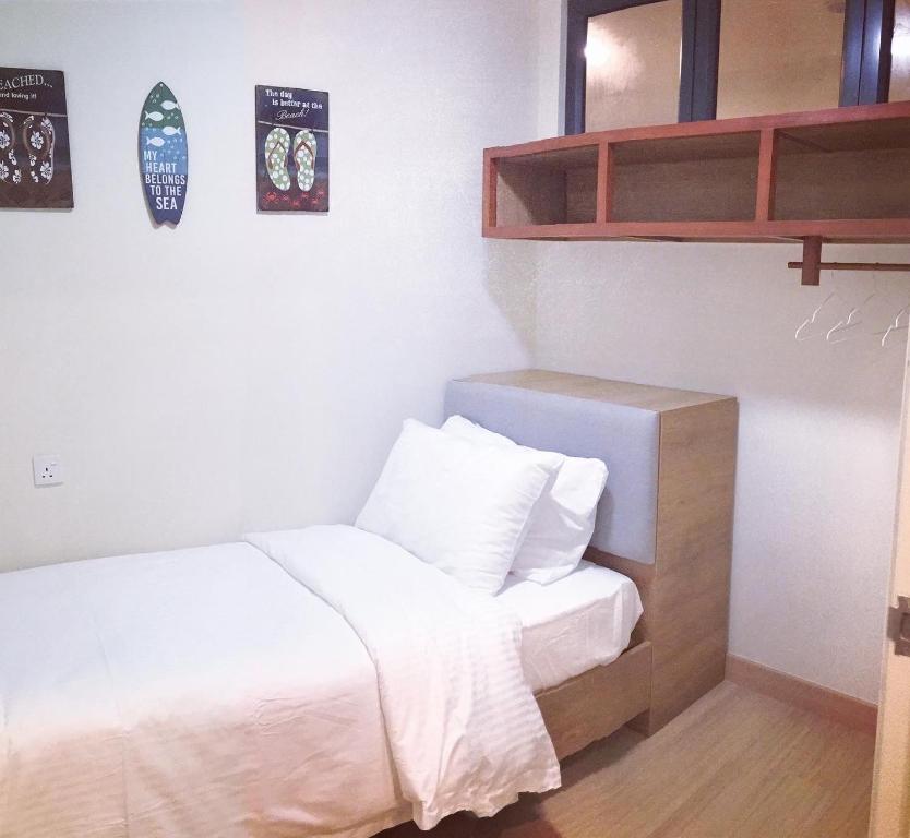 Postel nebo postele na pokoji v ubytování kuantan staycationtimurbay