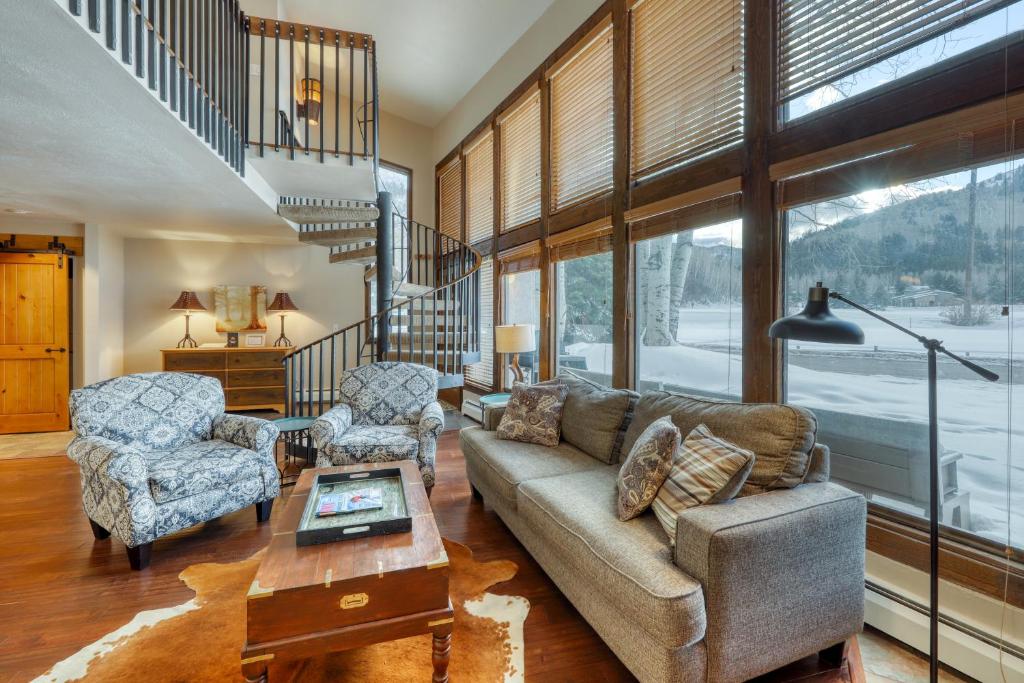 a living room with a couch and two chairs and a table at Golf & Ski Premier in Vail