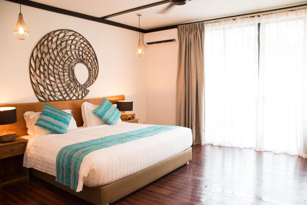 Postel nebo postele na pokoji v ubytování Borneo Divers Mabul Resort