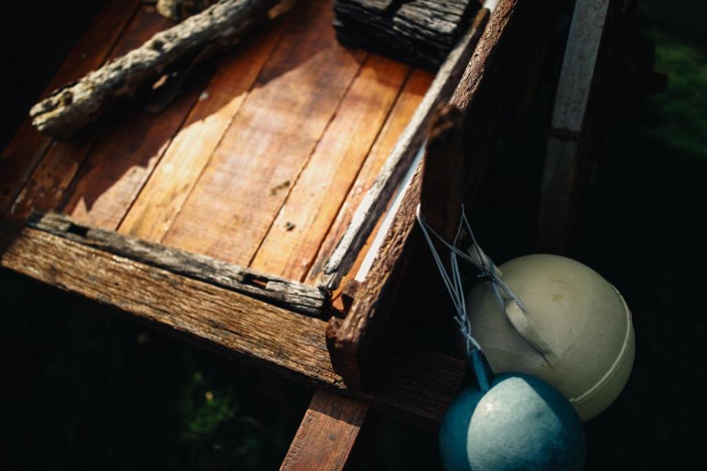 a wooden box with a ball and a spoon at Blue Lagoon in Huxi