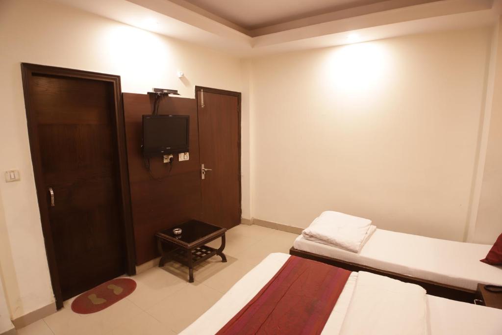Postel nebo postele na pokoji v ubytování Hotel Golden Wings