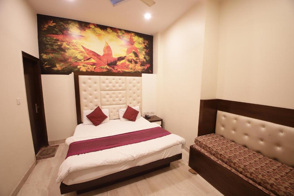 Postel nebo postele na pokoji v ubytování Hotel Golden Wings