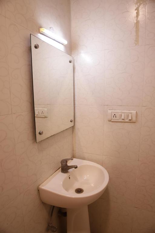 Koupelna v ubytování Hotel Golden Wings