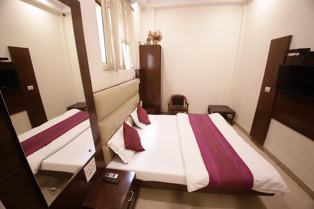 Postel nebo postele na pokoji v ubytování Hotel Golden Wings