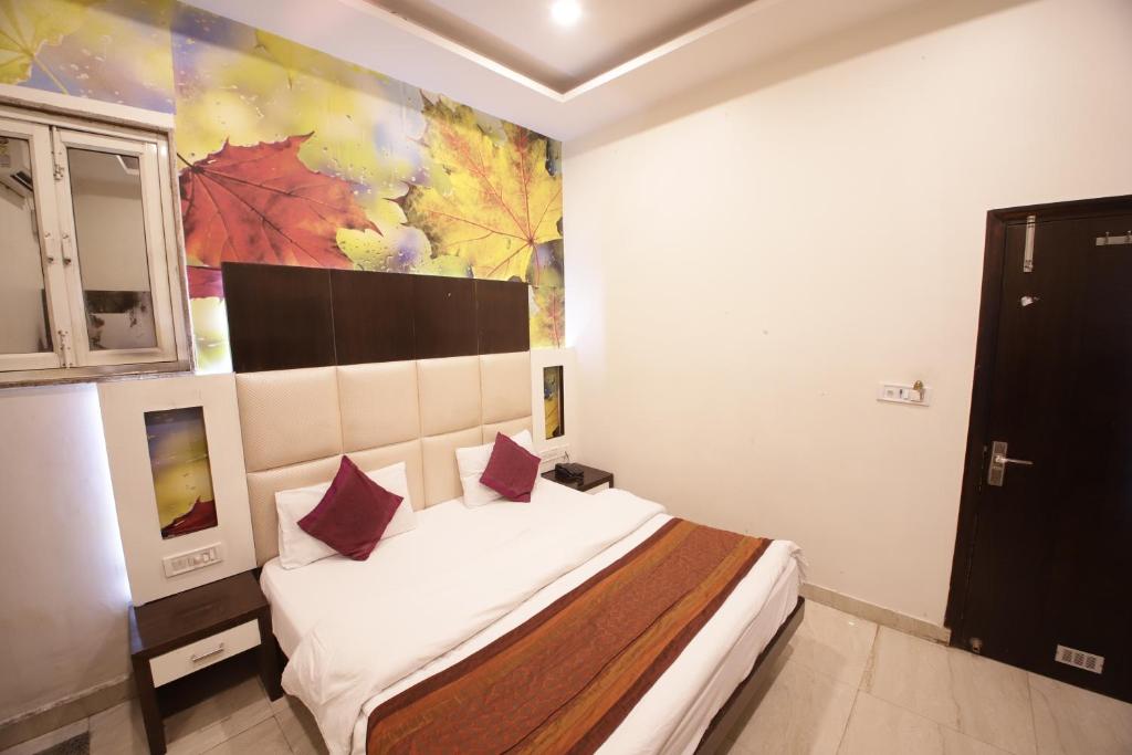 Postel nebo postele na pokoji v ubytování Hotel Golden Wings