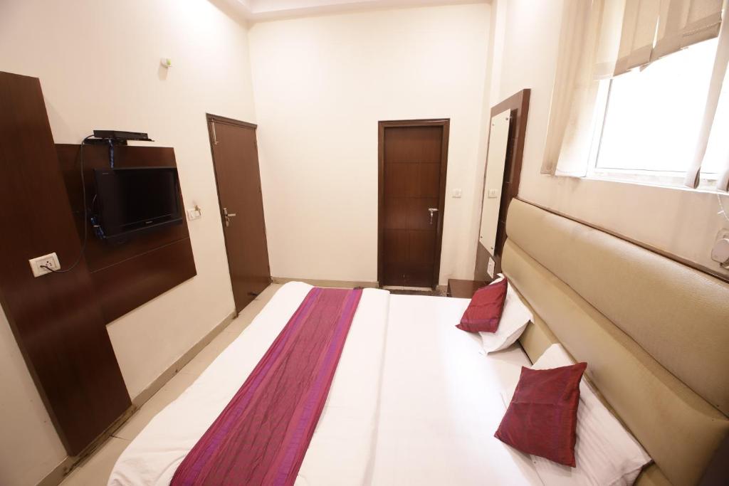 Postel nebo postele na pokoji v ubytování Hotel Golden Wings