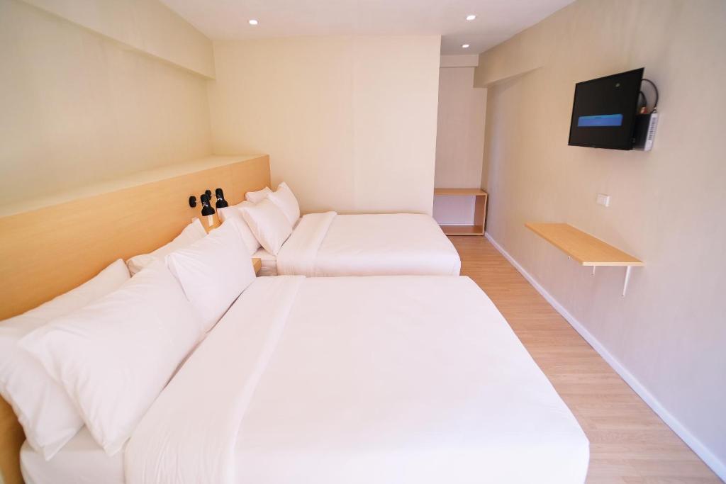 Postel nebo postele na pokoji v ubytování Bridge Hotel Express