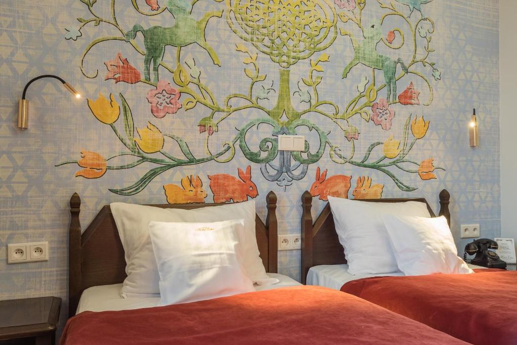 Postel nebo postele na pokoji v ubytování Hotel Ester