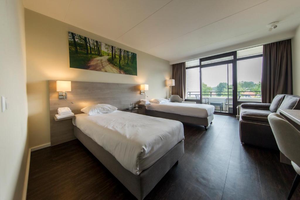 Postel nebo postele na pokoji v ubytování Fletcher Hotel-Restaurant Frerikshof