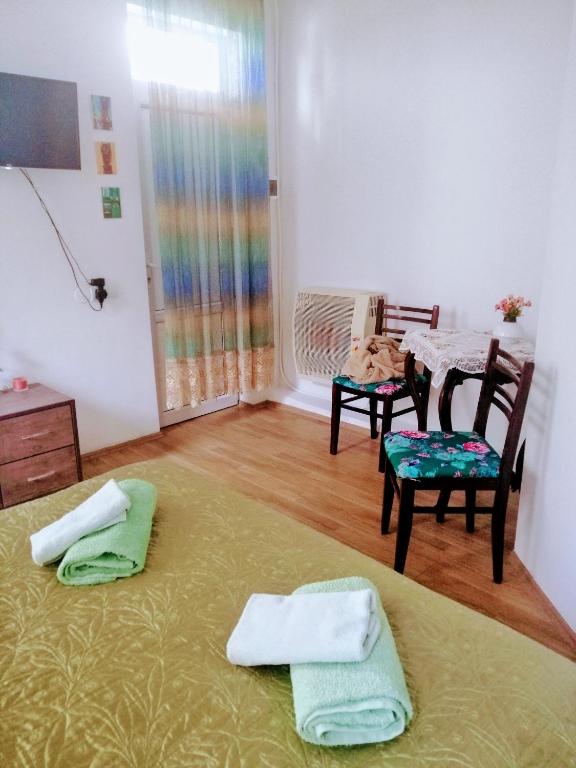 Postel nebo postele na pokoji v ubytování Guest House Marina