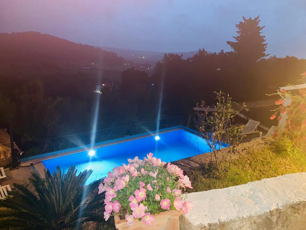 The swimming pool at or close to Ermones Emerald Villa