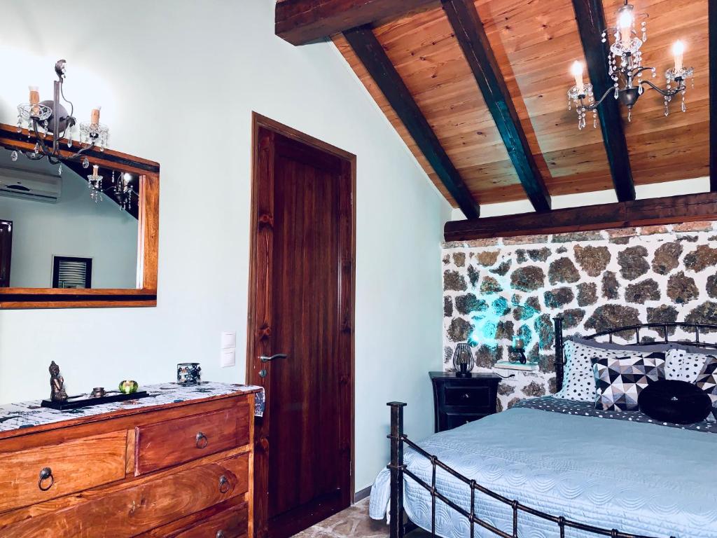 A bed or beds in a room at Ermones Emerald Villa