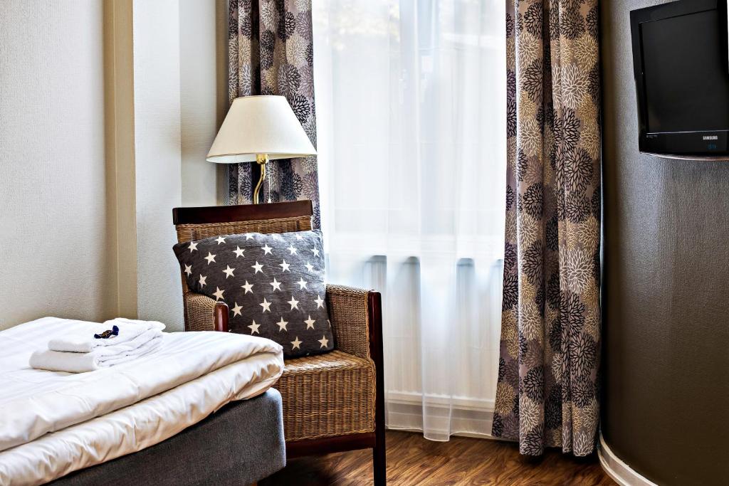 Postel nebo postele na pokoji v ubytování Best Western Tidbloms Hotel