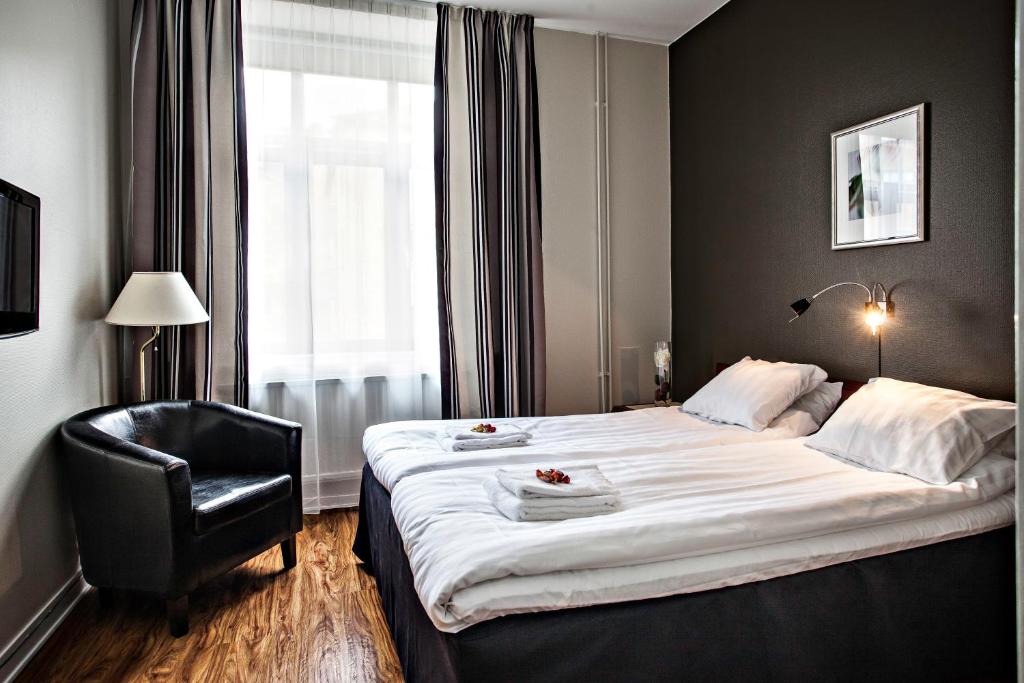 Postel nebo postele na pokoji v ubytování Best Western Tidbloms Hotel