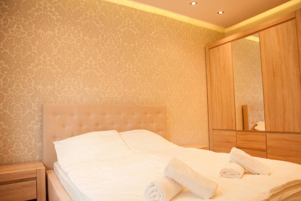 Posteľ alebo postele v izbe v ubytovaní Apartament Turoszowska