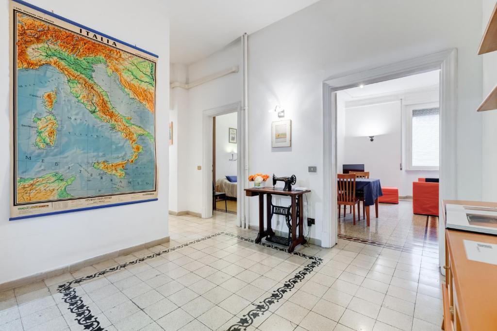 a large map hanging on a wall in a living room at Appartamento con 3 camere da letto e 2 bagni vicino al Vaticano in Rome