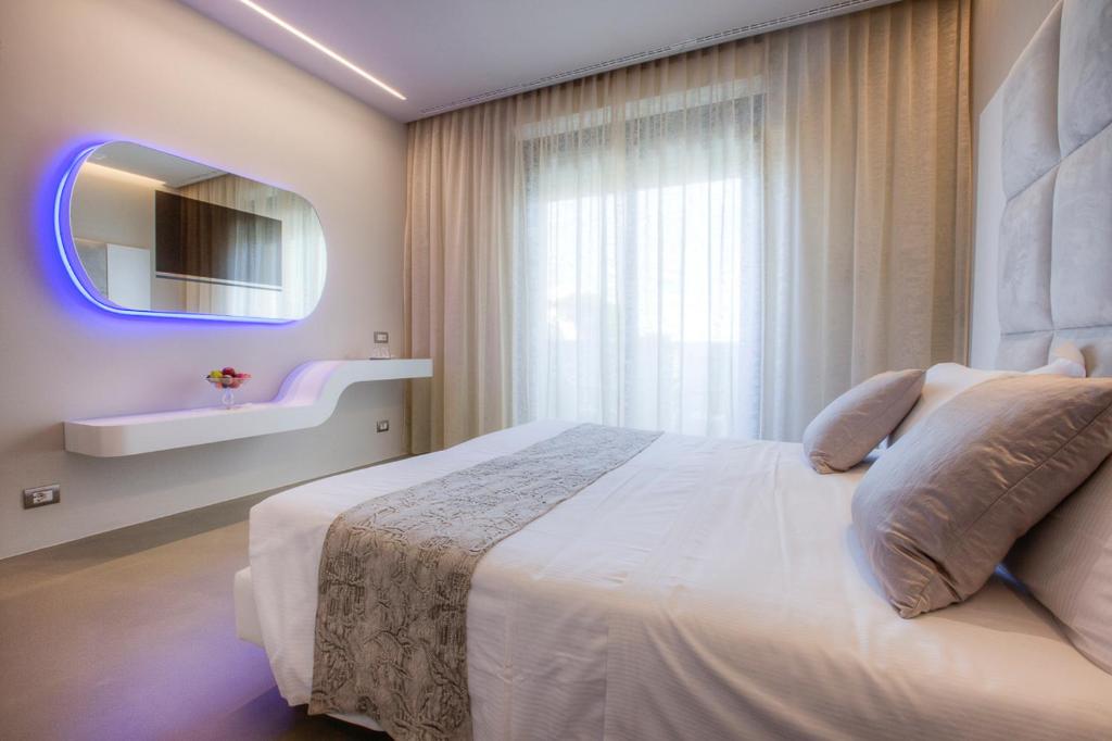 Postel nebo postele na pokoji v ubytování Hotel Nettuno