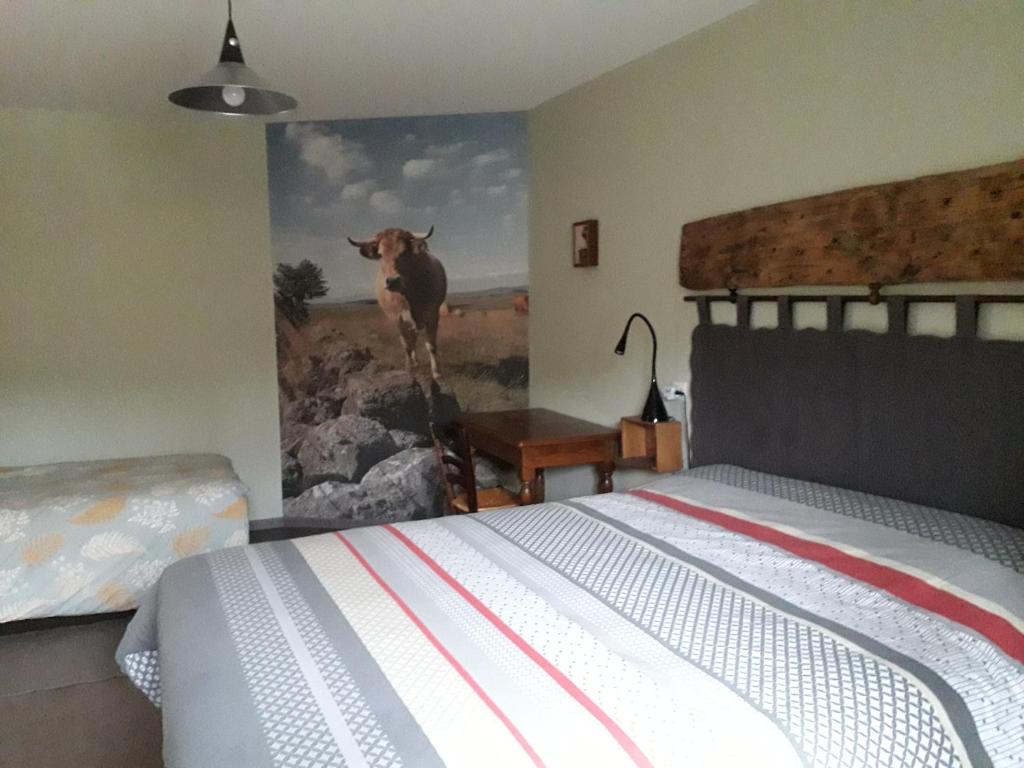 Postel nebo postele na pokoji v ubytování Chambre d'hôtes Le Cascadou