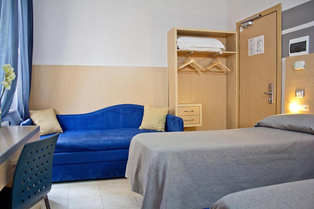 Postel nebo postele na pokoji v ubytování Hotel La Scaletta